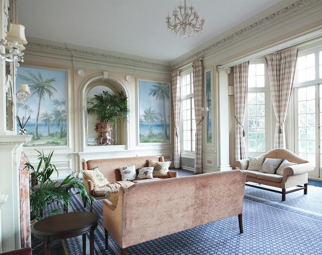 Tropical hand-painted scenic mural wallpaper with palm trees in traditional sitting room