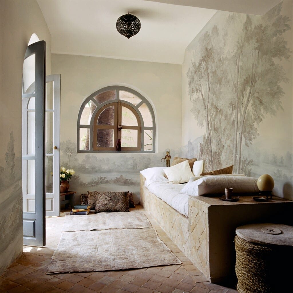 Hand painted grisaille scenic mural in rustic villa entryway foyer