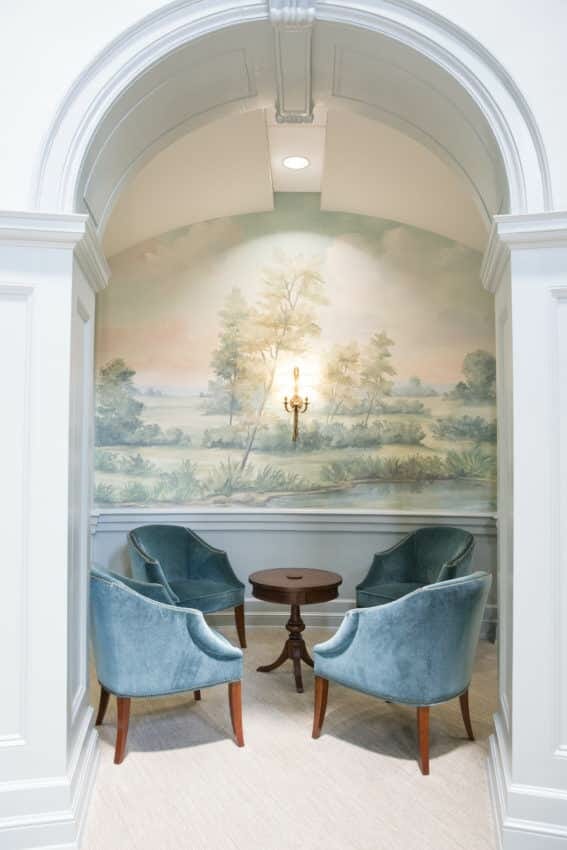 Sitting alcove with scenic mural wallpaper