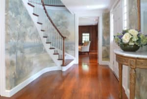 Curved stairway with scenic mural wallpaper