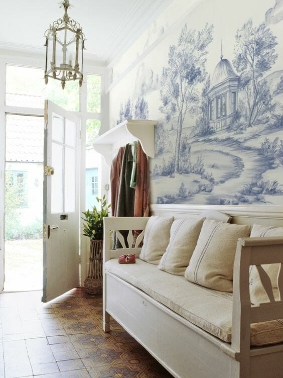 blue and white luxury handpainted printed scenic mural wallpaper in bright entryway foyer hallway